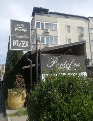 a building with a sign in front of a restaurant at Gaga Gold in Belgrade