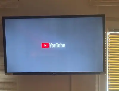 a television screen with a youtube sign on it at Gaga Gold in Belgrade