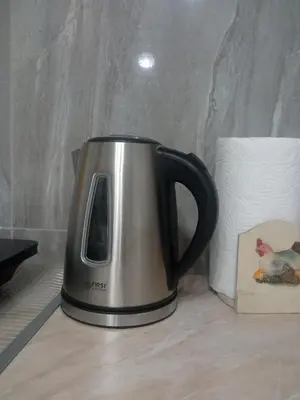a coffee pot sitting on a counter next to a roll of paper towels at Studio Lotos in Belgrade