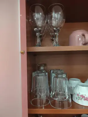 a row of wine glasses on a shelf at Lira Beo in Vračar (historical)