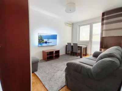 a living room with a couch and a table at Lira Beo in Vračar (historical)