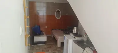 a small bathroom with a bed and a sink at Small Apartment FREE TRANSPORTATION FROM THE AIRPORT TO THE APARTMENT in Belgrade