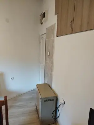 a room with a small box on the wall at Small Apartment FREE TRANSPORTATION FROM THE AIRPORT TO THE APARTMENT in Belgrade
