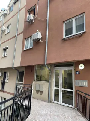 aartment building with a building with a door and a building at Gaga 1 in Filmski Grad