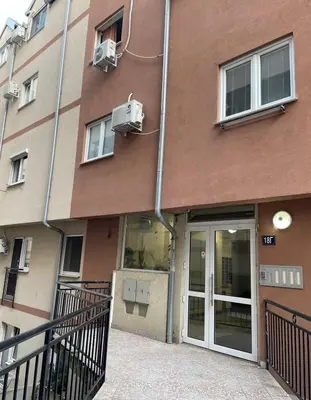 a building with a building with a door at Gaga 1 in Filmski Grad