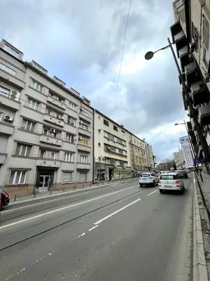 a street with cars driving down a street with buildings at TRIANGLE CITY Apartment 1 in Belgrade