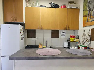 a kitchen with a counter with two mats on it at The Traveling Theater in Belgrade