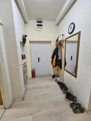 a hallway with a mirror and a row of shoes at The Traveling Theater in Belgrade