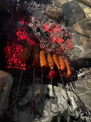 a bunch of hot dogs on a grill at Kućica in Velika Remeta