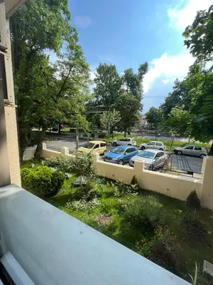 a group of cars parked in a parking lot at Cabbage Hostel in Belgrade