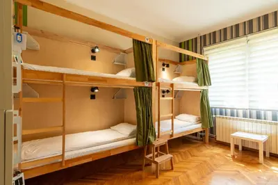 a room with bunk beds in a hostel at Cabbage Hostel in Belgrade