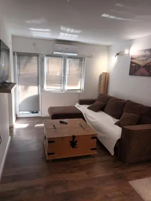 a living room with a couch and a coffee table at Aurora in Zvezdara