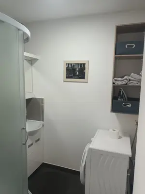 a white bathroom with a sink and a toilet at Aurora in Zvezdara