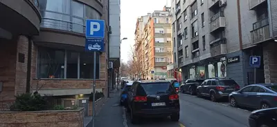 a car parked on the side of a city street at Belgrade St Sava Temple Hram in Belgrade