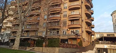 a tall building with balconies on the side of it at Belgrade St Sava Temple Hram in Belgrade