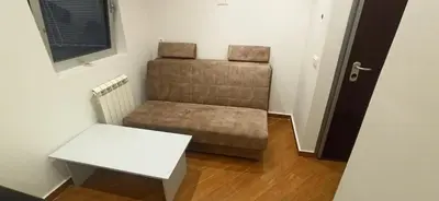 a small room with a couch and a table at Belgrade St Sava Temple Hram in Belgrade