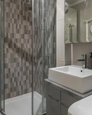 a bathroom with a sink and a glass shower at Belgrade Center Apartment in Belgrade