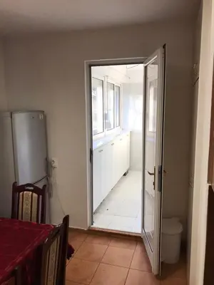 an open door leading to a kitchen with a window at Bulevar NT Novi Beograd, Zemun in Belgrade