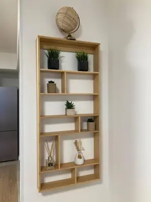 a wooden shelf with potted plants on a wall at MarijaN Belgrade Waterfront in Sajmište