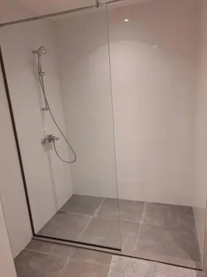 a shower with a glass door in a bathroom at MarijaN Belgrade Waterfront in Sajmište