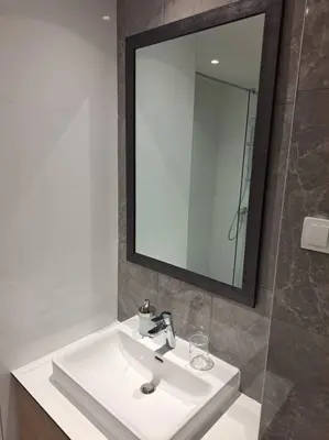 a bathroom with a white sink and a mirror at MarijaN Belgrade Waterfront in Sajmište