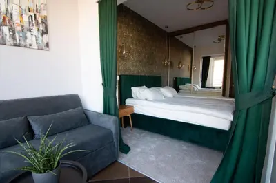 a hotel room with a bed and a couch at Square 6 in Belgrade