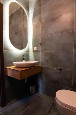 a bathroom with a sink and a mirror at Square 6 in Belgrade