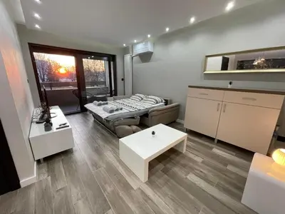 a living room with a couch and a table at Alisa Novi Beograd in Bežanija