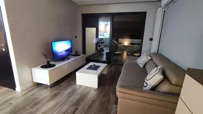 a living room with a couch and a flat screen tv at Alisa Novi Beograd in Bežanija