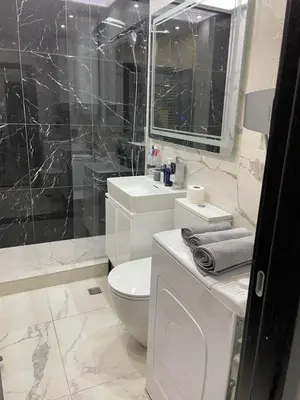 a bathroom with a toilet and a sink and a shower at Alisa Novi Beograd in Bežanija
