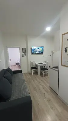 a living room with a couch and a table at Gepratova Apartment in Belgrade