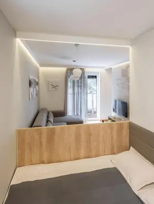 a living room with a couch and a tv at Star32 in Vračar (historical)