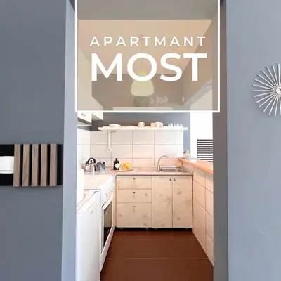 an image of a kitchen with the words apartment most at Most apartman in Ruma