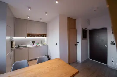 a kitchen and dining room with a table and chairs at Roof terrace in the heart of Belgrade in Belgrade