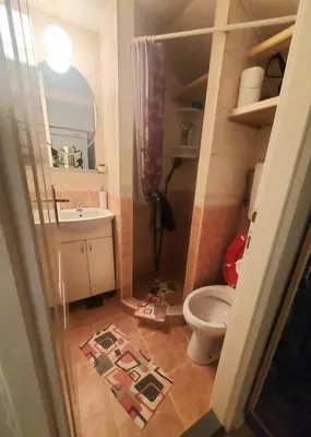 a small bathroom with a toilet and a sink at Glorry M in Belgrade