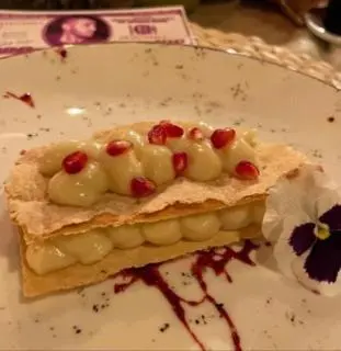 a sandwich with fake teeth on a plate at Biser in Filmski Grad
