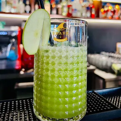 a drink with a slice of lime in a glass at Biser in Filmski Grad
