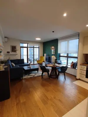 a living room with a couch and a table at 2-Bedroom Oasis in the heart of the Waterfront in Sajmište