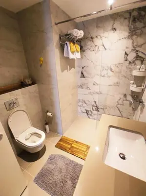 a bathroom with a toilet and a sink at 2-Bedroom Oasis in the heart of the Waterfront in Sajmište