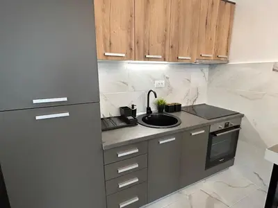 a small kitchen with a sink and a refrigerator at Delete 8 in Novi Grad