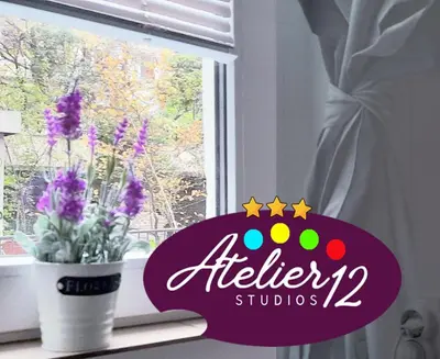 a window with a sign that reads alergy studios at ATELIER 12, Feeling like an artist! PROMO PRICE in Belgrade