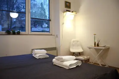 a room with a bed with towels on it at ATELIER 12, Feeling like an artist! PROMO PRICE in Belgrade