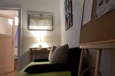 a living room with a couch and a lamp at ATELIER 12, Feeling like an artist! PROMO PRICE in Belgrade