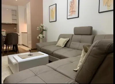 a living room with a couch and a table at Belgrade Waterfront Premium in Belgrade