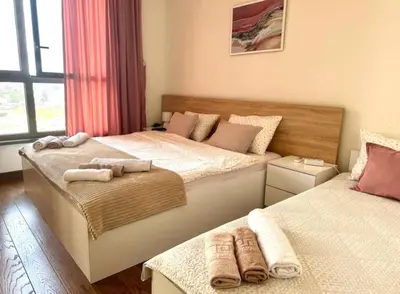 a bedroom with two beds with towels on them at Belgrade Waterfront Premium in Belgrade