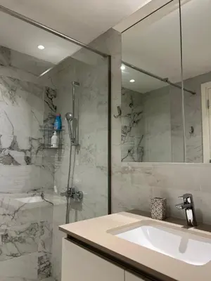 a bathroom with a sink and a glass shower at Belgrade Waterfront Premium in Belgrade