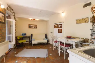 a kitchen with a sink and a table with a desk at Hidden Gem on Prime Location in Belgrade