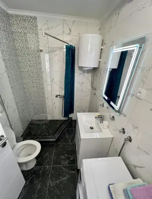 a bathroom with a toilet and a sink at Marina2 in Belgrade
