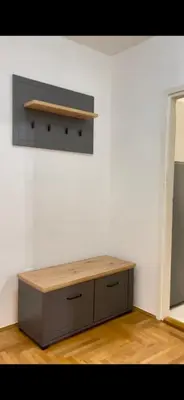 a table in a room with a white wall at Marina2 in Belgrade