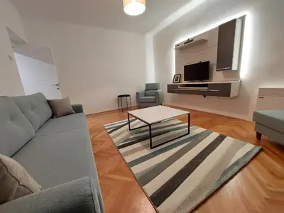 a living room with a couch and a table at Dalmatinska apartment in Belgrade